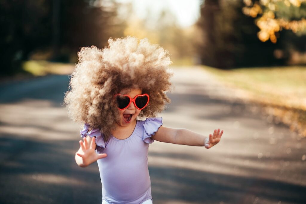 MelodyTykes kid with wig and glasses